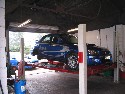 Subaru WRX in workshop for brake repairs (click to enlarge)